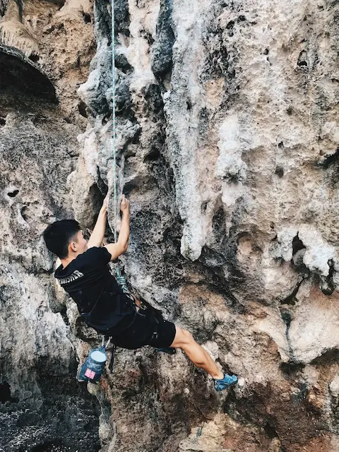 me bouldering a cliff feature